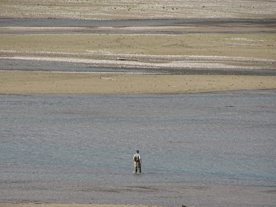 Pêcheur dans les hauts-fonds du lac Supérieur